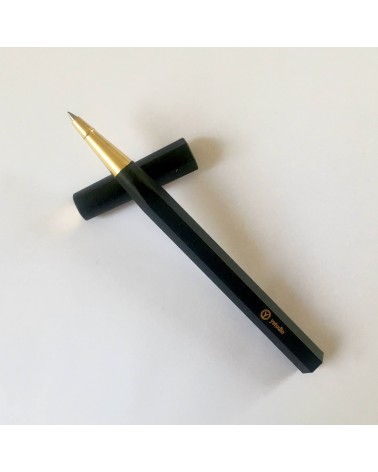 Roller de Ystudio en résine acrylique et laiton, noir.  A L'Ecritoire design, Lausanne.